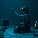 Woman immersed in virtual reality, surrounded by tech, in a dimly lit room.